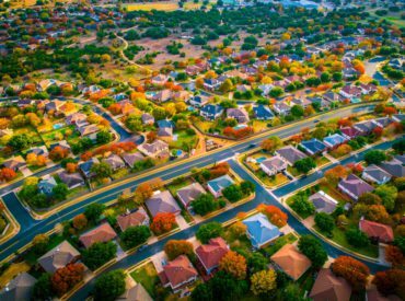 arial, photo, of, homes, in, the, fall, with, colourful, trees