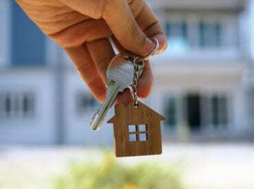 hand holding keys for new home