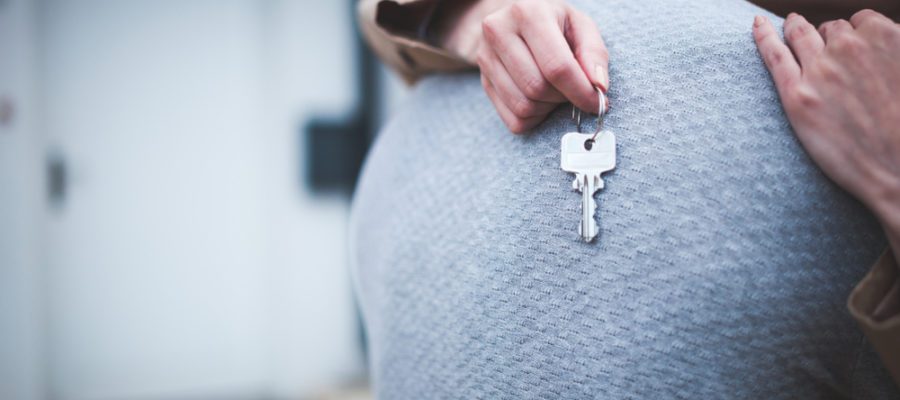 Millennials,Woman,Holding,Keys,Hugging,Husband,In,Front,Of,Their